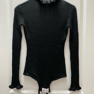 Black turtle neck body suit